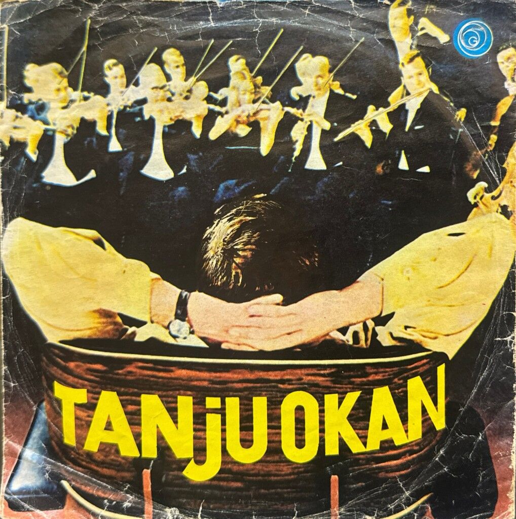 Tanju Okan – Kemancı / Gülünce Gözlerinin İçi Gülüyor 45'lik